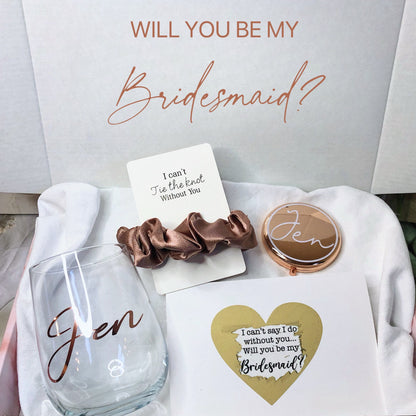 Our personalized gift box, perfect for any special occasion, includes a customized box, card, champagne flute or stemless glass, and message scrunchies, available in elegant Marble Pink or White Ribbon.