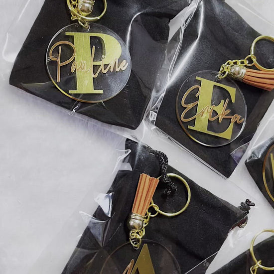 Discover the perfect personalized acrylic keyring for kids or flower girls, featuring custom vinyl names, available in various tassel colors, and packaged in a black velvet pouch—ideal for any special occasion.