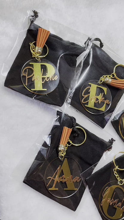 Discover the perfect personalized acrylic keyring for kids or flower girls, featuring custom vinyl names, available in various tassel colors, and packaged in a black velvet pouch—ideal for any special occasion.