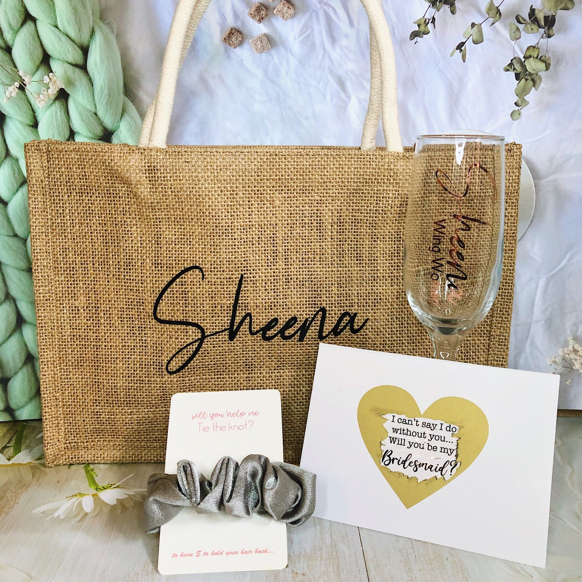 Our bundle includes a personalized jute bag, bridesmaid or Maid of Honour card, champagne flute or stemless glass, and message scrunchies, perfect for stylish and heartfelt bridal party gifts.