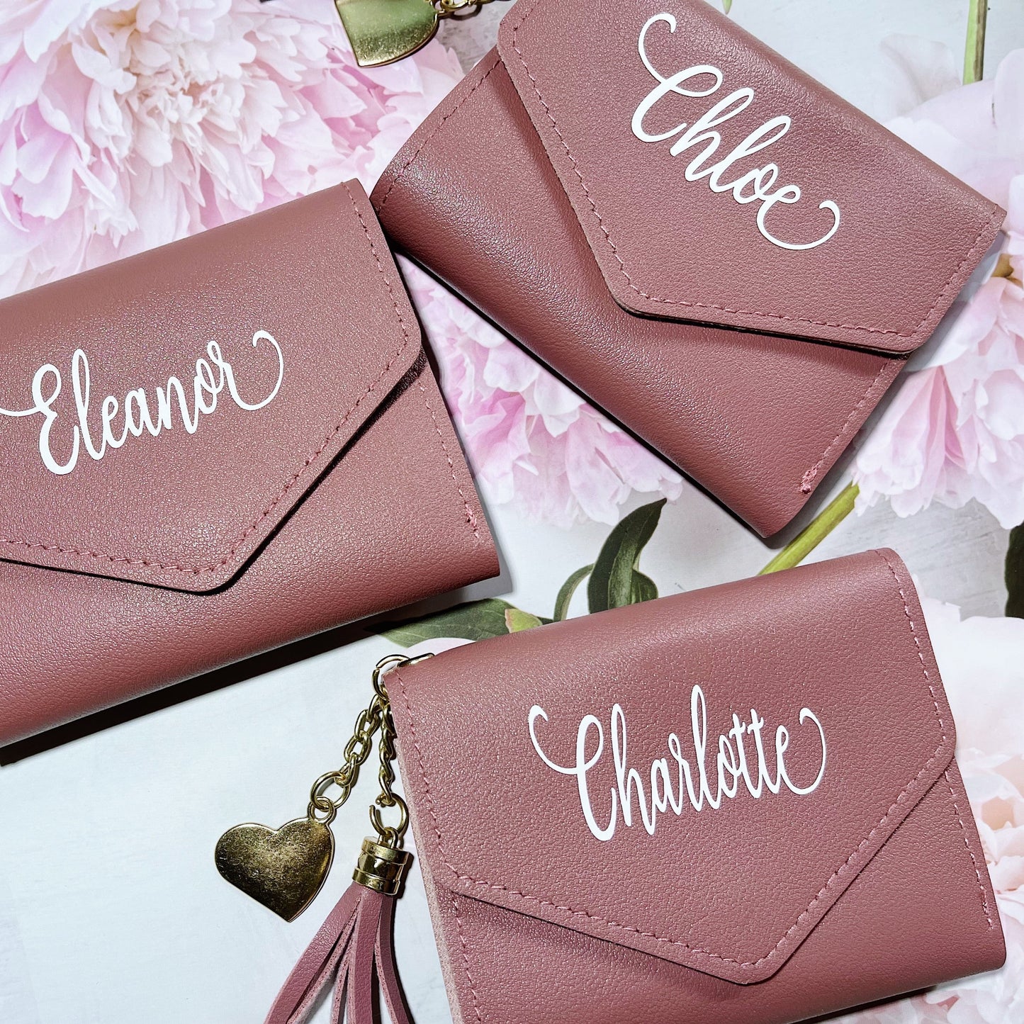 Explore our collection of personalized wallets, available in a range of colors, perfect for keeping your essentials organized in style or as a thoughtful gift for someone special.