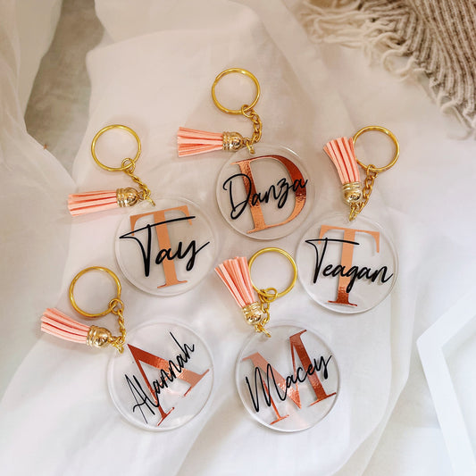 Discover the perfect personalized acrylic keyring for kids or flower girls, featuring custom vinyl names, available in various tassel colors, and packaged in a black velvet pouch—ideal for any special occasion.